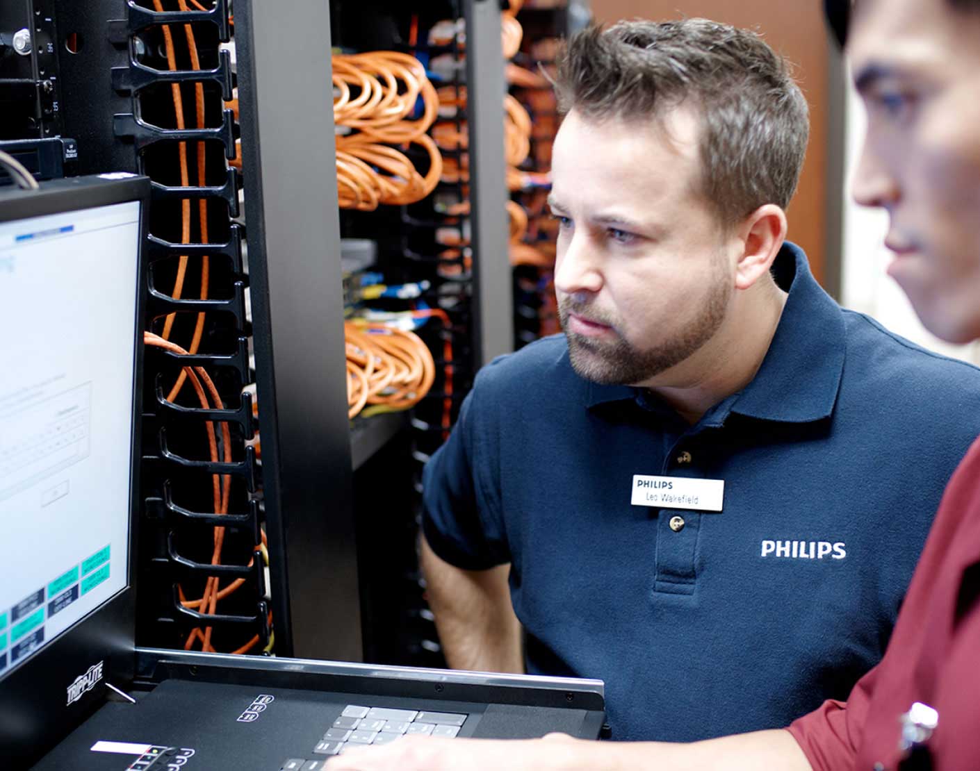 Two men checking screen